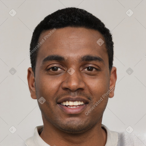 Joyful black young-adult male with short  black hair and brown eyes