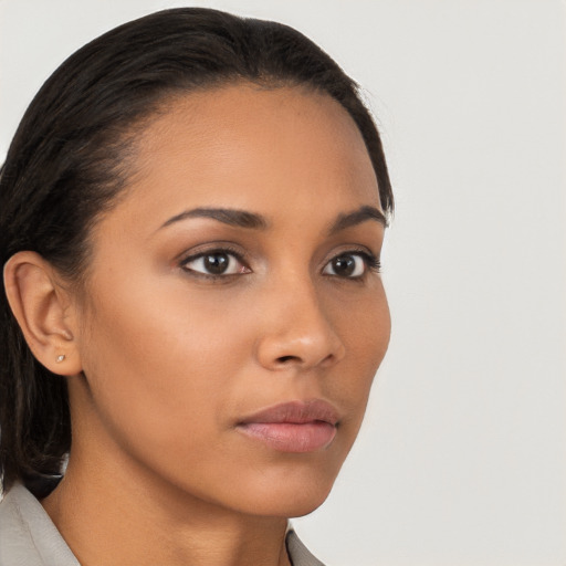 Neutral latino young-adult female with medium  brown hair and brown eyes