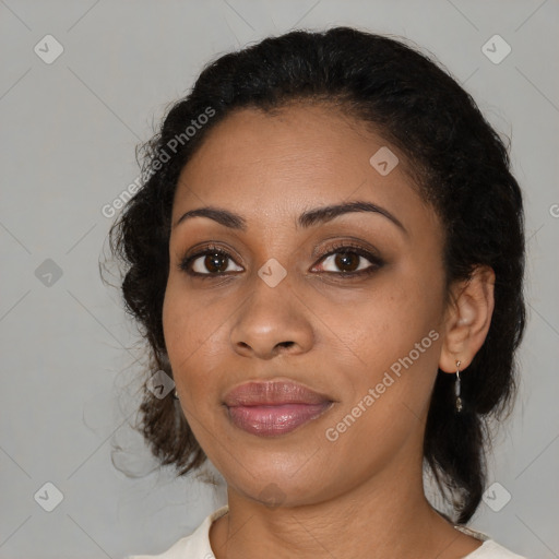 Joyful black young-adult female with medium  black hair and brown eyes