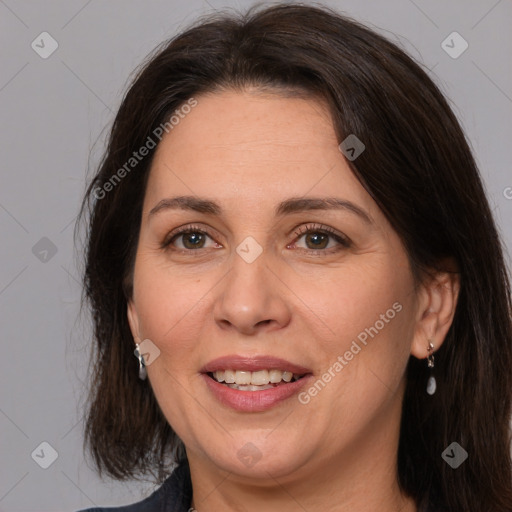 Joyful white adult female with medium  brown hair and brown eyes