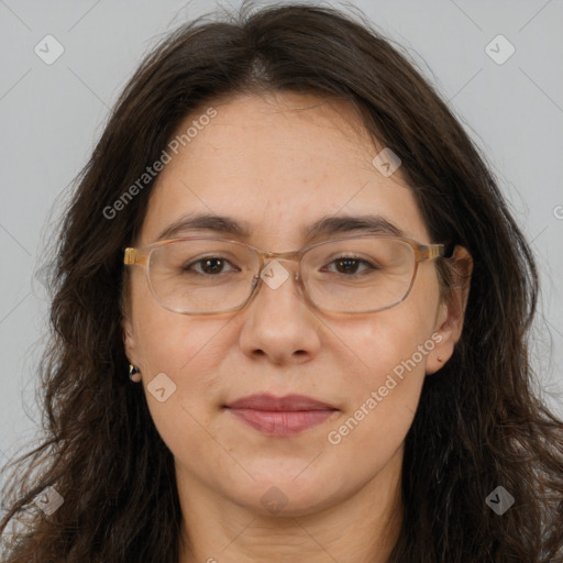 Joyful white adult female with long  brown hair and brown eyes