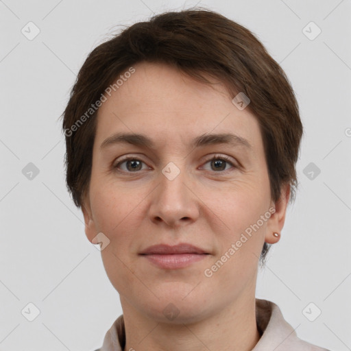 Joyful white adult female with short  brown hair and grey eyes