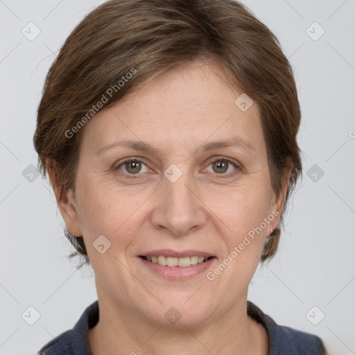 Joyful white adult female with medium  brown hair and grey eyes