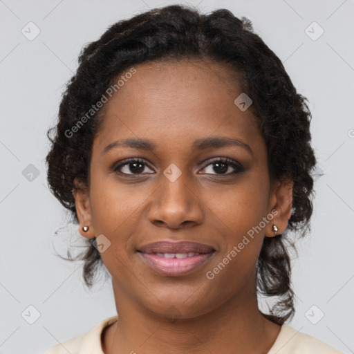 Joyful black young-adult female with long  brown hair and brown eyes