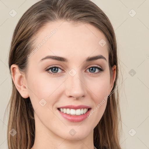 Joyful white young-adult female with long  brown hair and blue eyes