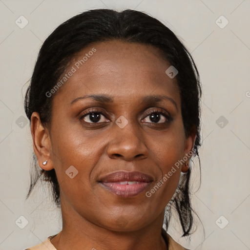 Joyful black young-adult female with medium  brown hair and brown eyes