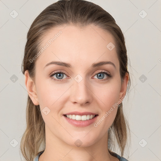 Joyful white young-adult female with medium  brown hair and blue eyes