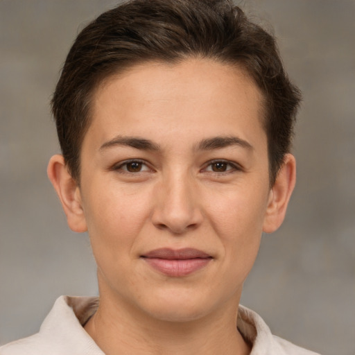 Joyful white young-adult female with short  brown hair and brown eyes