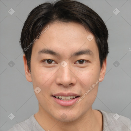 Joyful asian young-adult male with short  brown hair and brown eyes