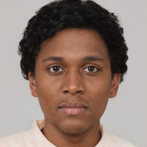 Neutral black young-adult male with short  brown hair and brown eyes