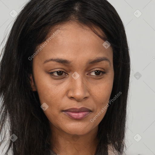 Joyful latino young-adult female with long  brown hair and brown eyes