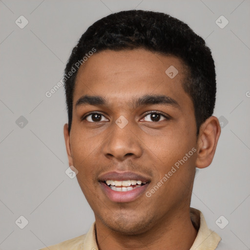 Joyful black young-adult male with short  black hair and brown eyes