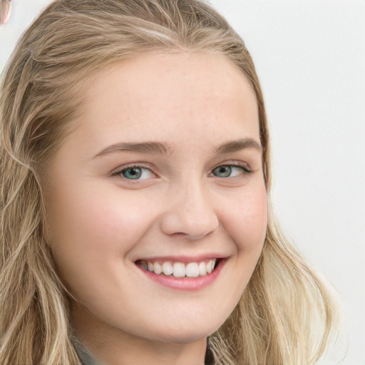 Joyful white young-adult female with long  brown hair and blue eyes