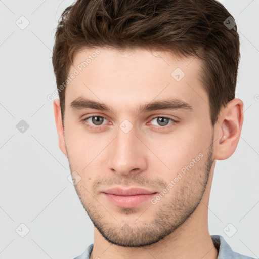 Neutral white young-adult male with short  brown hair and grey eyes