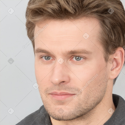 Joyful white adult male with short  brown hair and grey eyes