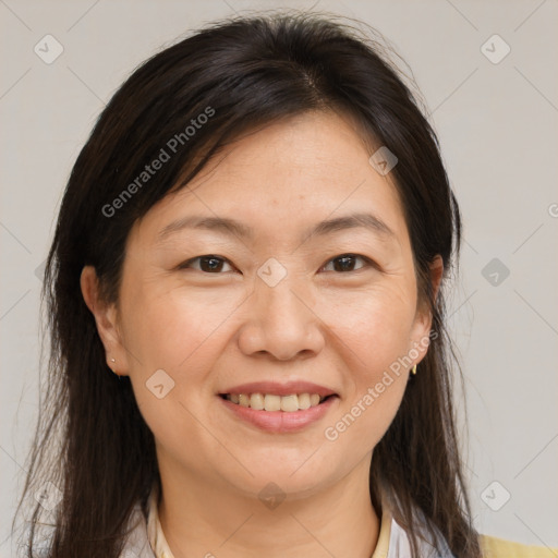 Joyful white adult female with medium  brown hair and brown eyes