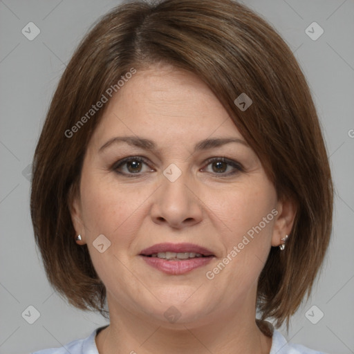 Joyful white adult female with medium  brown hair and brown eyes