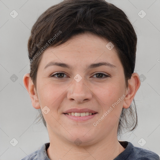 Joyful white young-adult female with medium  brown hair and brown eyes