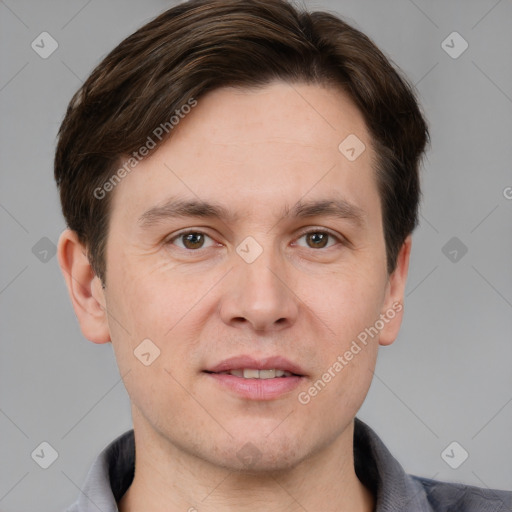 Joyful white adult male with short  brown hair and brown eyes