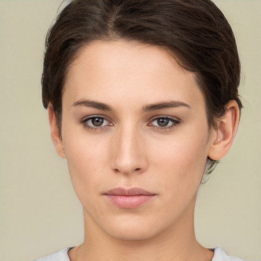 Neutral white young-adult female with short  brown hair and brown eyes