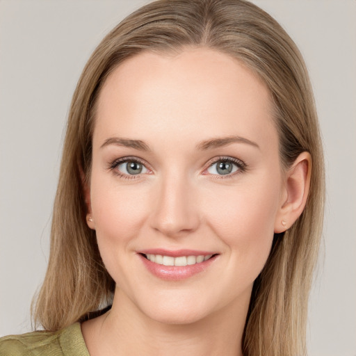 Joyful white young-adult female with medium  brown hair and green eyes