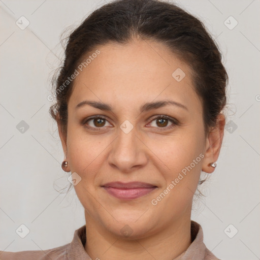 Joyful white adult female with short  brown hair and brown eyes