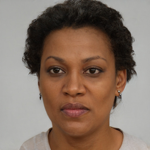 Neutral black adult female with short  brown hair and brown eyes