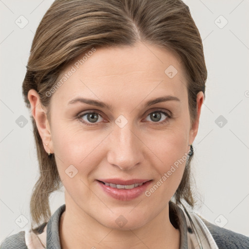 Joyful white young-adult female with medium  brown hair and grey eyes