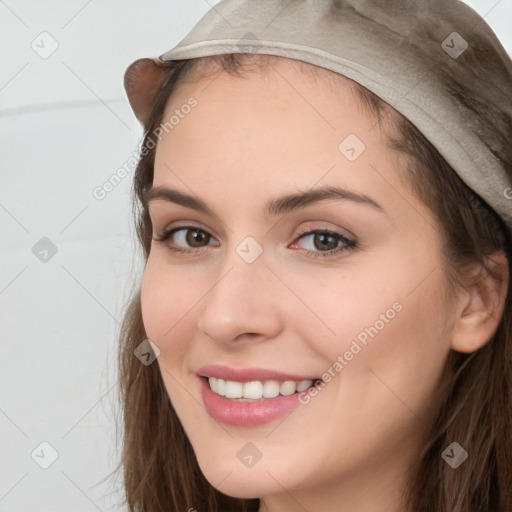 Joyful white young-adult female with long  brown hair and brown eyes