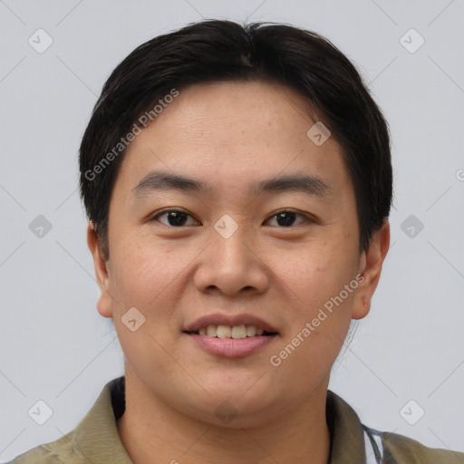 Joyful asian young-adult male with short  brown hair and brown eyes