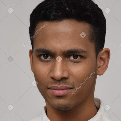 Joyful latino young-adult male with short  brown hair and brown eyes