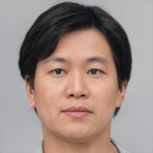 Neutral asian young-adult male with medium  brown hair and brown eyes