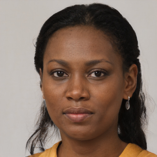 Neutral black young-adult female with medium  black hair and brown eyes