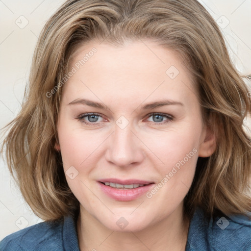 Joyful white young-adult female with medium  brown hair and blue eyes