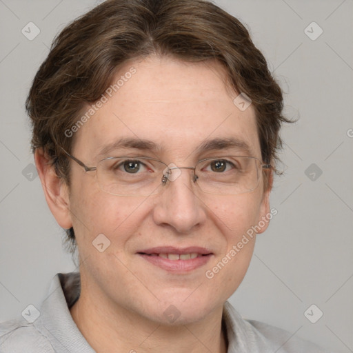 Joyful white adult female with short  brown hair and grey eyes