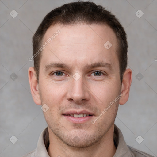 Joyful white young-adult male with short  brown hair and brown eyes