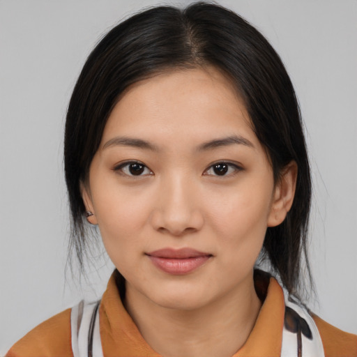 Joyful latino young-adult female with medium  black hair and brown eyes