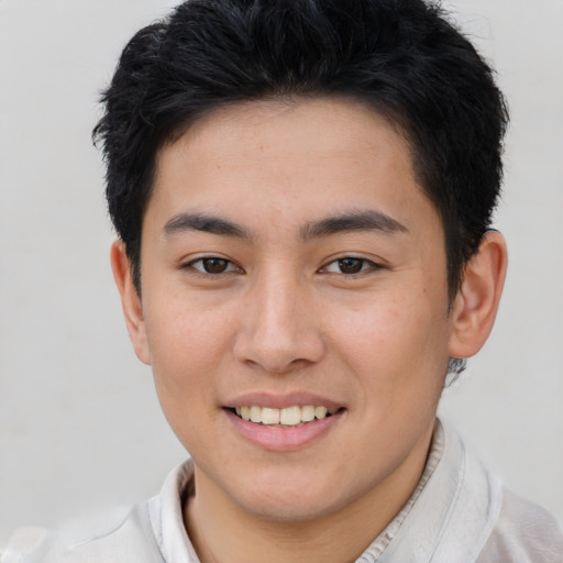 Joyful asian young-adult female with short  brown hair and brown eyes