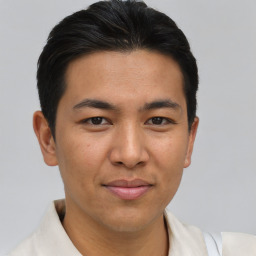 Joyful asian young-adult male with short  brown hair and brown eyes