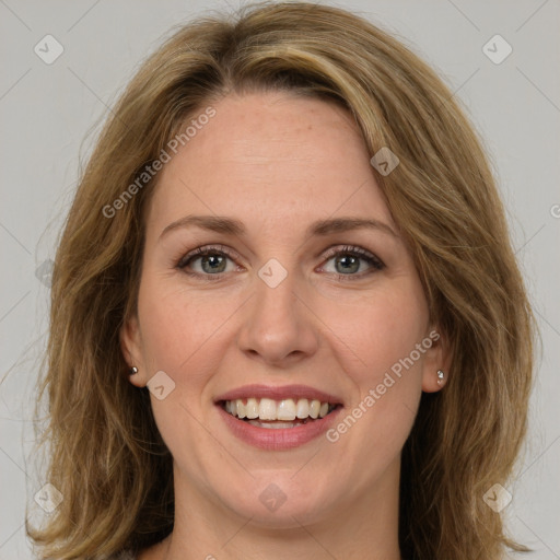 Joyful white young-adult female with medium  brown hair and green eyes