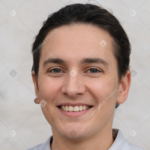 Joyful white young-adult male with short  brown hair and brown eyes