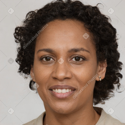 Joyful black adult female with medium  brown hair and brown eyes