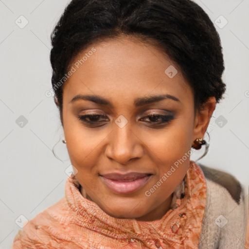 Joyful black young-adult female with short  brown hair and brown eyes