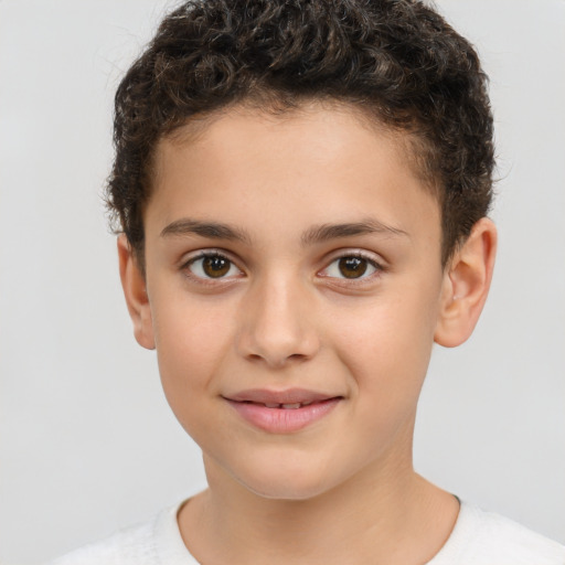 Joyful white child male with short  brown hair and brown eyes