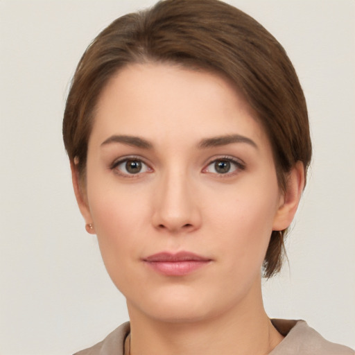 Neutral white young-adult female with short  brown hair and brown eyes