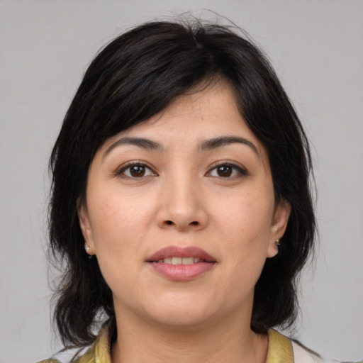 Joyful asian young-adult female with medium  brown hair and brown eyes
