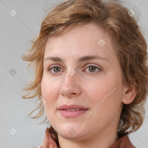 Joyful white young-adult female with medium  brown hair and blue eyes