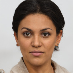 Joyful latino young-adult female with medium  brown hair and brown eyes