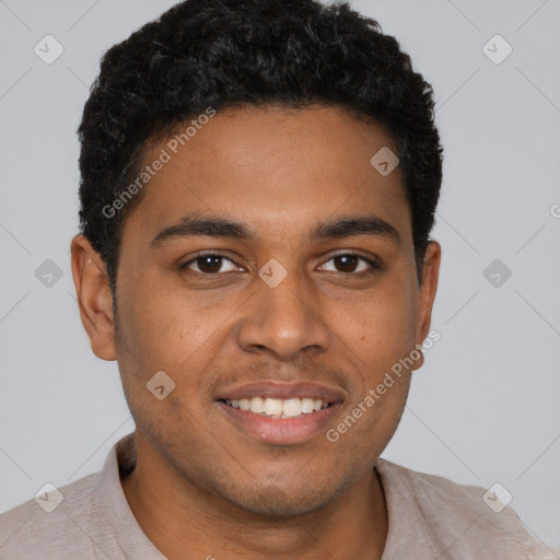 Joyful black young-adult male with short  brown hair and brown eyes