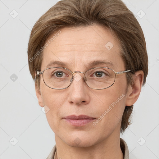 Joyful white adult female with short  brown hair and grey eyes